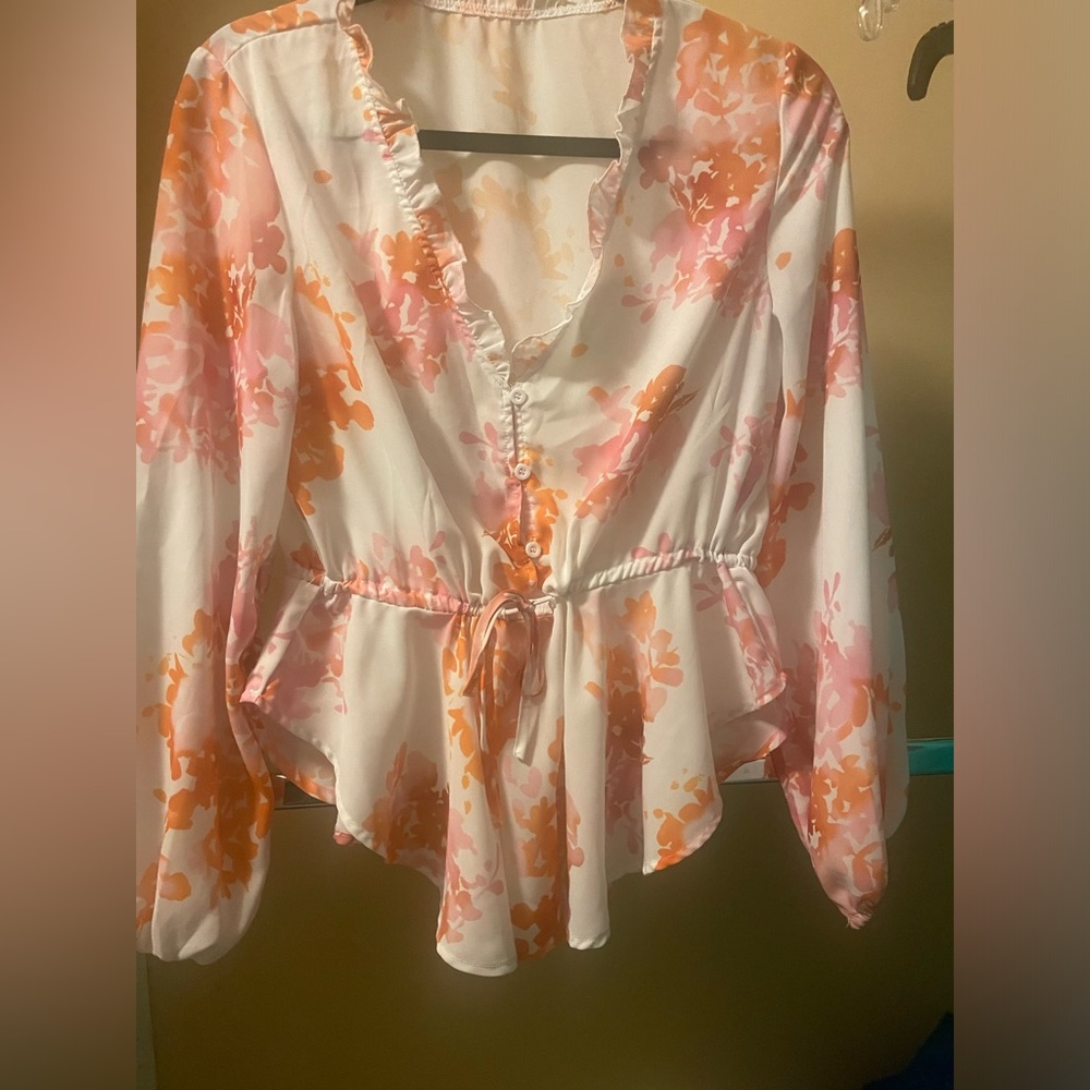 Blouse with cinch tie in the front. Orange and pink flowers. Size small.